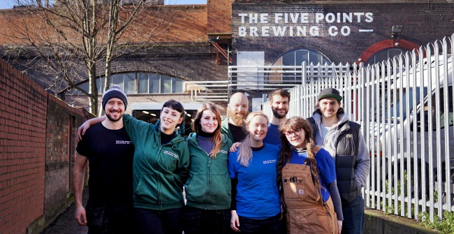 The brewery team at The Five Points Brewing Company standing outside the brewery in Hackney, London