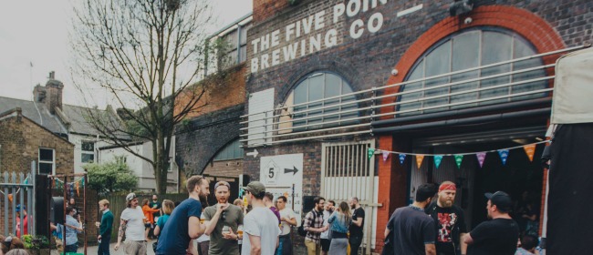 A group of people drinking beer outside The Five Points Brewing Company in Hackney, East London