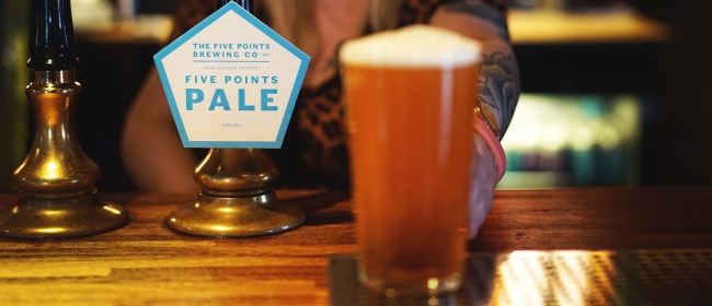 A bartender serving a pint of Five Points Pale at the Pembury Tavern in Hackney
