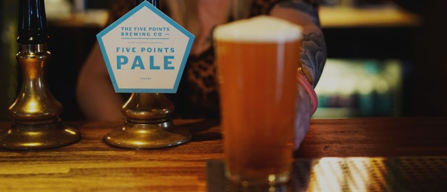 A pint of Five Points Pale being passed over the bar at The Pembury Tavern