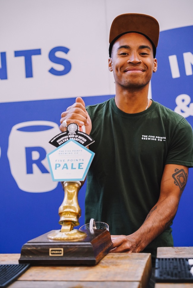 Bartender pouring a pint of Five Points Pale at The Great British Beer Festival